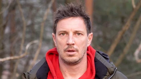 A close up of a scared man looking into the camera Stock Footage 103956775