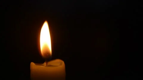 Close-up scary horror glowing red fire of a candle during halloween night. 库存影片 211337887