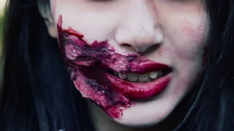 Close up of scary monster with grimace on face, cannibal wants to bite victim Stock Footage 87312656