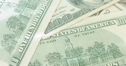 Close up of scattered hundred dollar bills Stock Footage 321750937