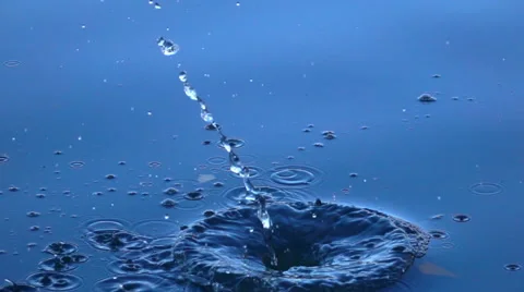 Close up scene of big stone falls into the calm blue water. 動画素材 57971557