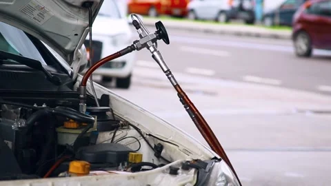  close-up scene of car engine while driver fills up with natural gas CNG Video stock 196136098