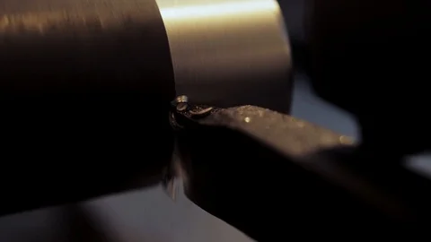 Close-up scene of lathe machine cutting the metal shaft parts. Stock Footage 123425664