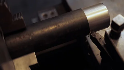 Close-up scene of lathe machine cutting the metal shaft parts. Stock Footage 123425694