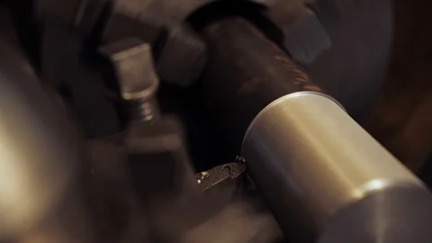 Close-up scene of lathe machine cutting the metal shaft parts. Stock Footage 123425722