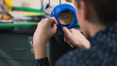 Close-up, Schoolboy Slashes Knife Excess Scotch Sticked on Airplane Fuselage Stock Footage 86669484