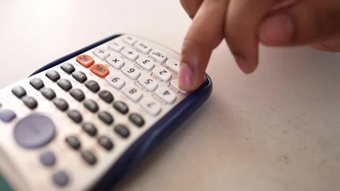 Close-up of a scientific calculator on a light surface video shot Stock Footage 318056728