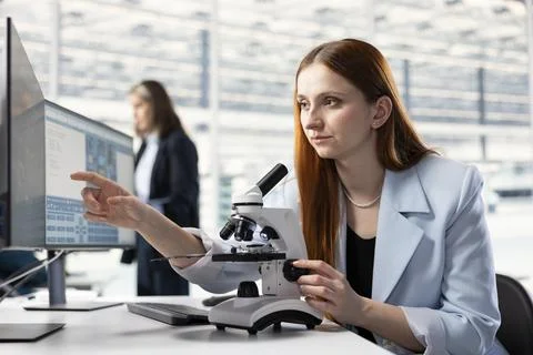 Close up of scientist examining PCB circuitry with microscope Stock Photos