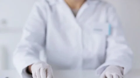 Close up of scientist with full beaker in lab Video stock 44937781