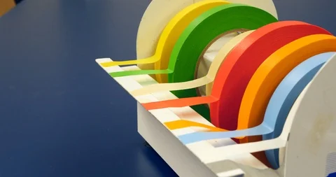 Close up on a scientist grabbing a piece of red tape to mark a piece of 스톡 동영상 101069986