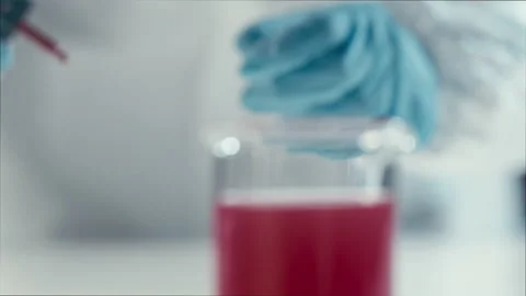 Close-up of scientist in laboratory working with tubes and liquids Stock Footage 149248411