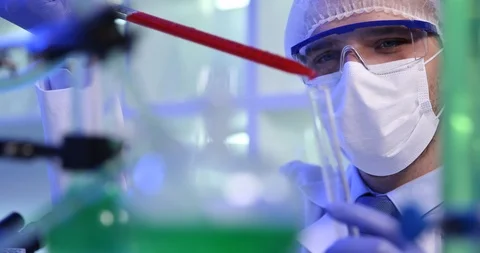 Close Up of Scientist Man Adding Study Liquid in Test Tube Use Lab Micro Pipette Stock Footage 87913558