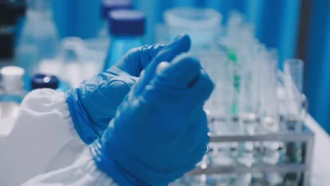 Close-up of scientist performing laboratory testing on a white mouse in a m.. Stock Footage 336564901