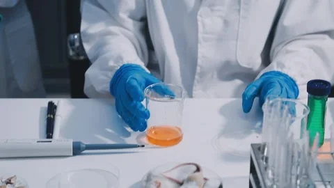 Close-up of scientist performing laboratory testing on a white mouse in a m.. Stock Footage 336565071
