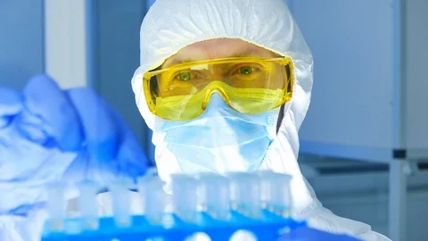 Close-up of Scientist in protective clothes checking dangerous materials in test Stock Footage 108198183