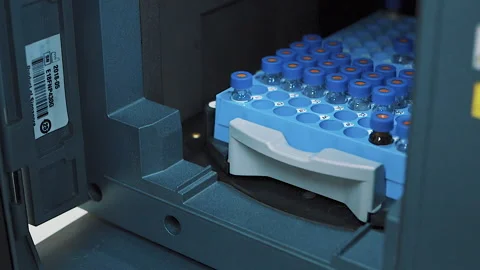 Close up scientist put experiment subjects into laboratory machine Stock-Footage 158524656