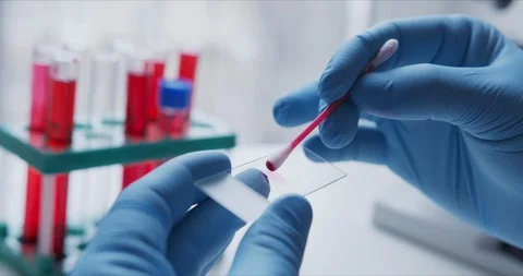 Close- up of scientist studying sample under microscope i Stock Footage 126164265