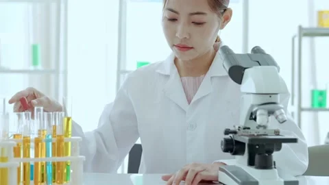 Close up scientist use microscope in the lab. Biotechnology researcher scientist Stock Footage 205497411
