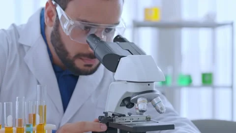 Close up scientist use microscope in the lab Stock Footage 224086667