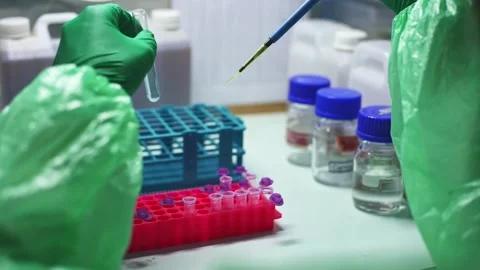 Close up scientist using pipette transfer sample to Micro Centrifuge Tube for PC Stock Footage 131551009