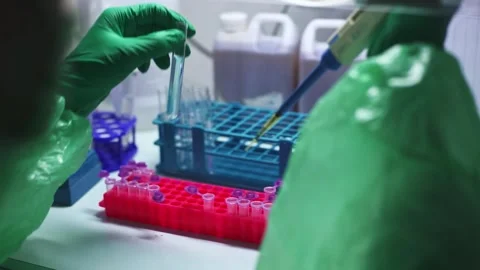 Close up scientist using pipette transfer sample to Micro Centrifuge Tube for PC Stock Footage 134551311