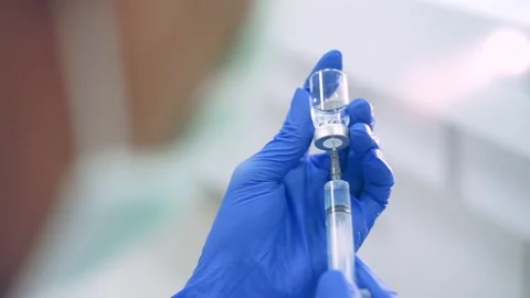 Close up scientist using pipette transfer sample in micro plate	 Stock Footage 144933684