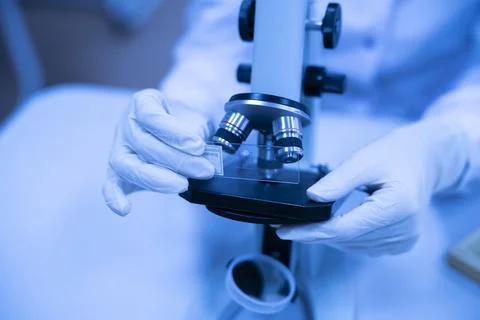 A close up scientist working in the laboratory using  microscope Stock Photos