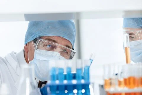 Close up. scientists discussing the results of testing a new vaccine. Stock Photos