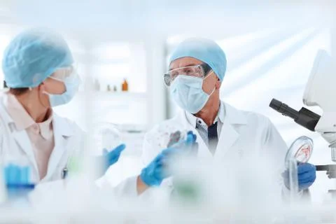 Close up. scientists discussing the results of their research. Stock Photos