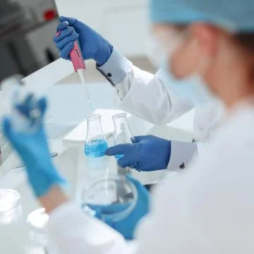 Close up. scientists examining liquid samples in the lab. Stock Photos