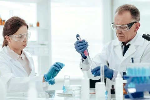 Close up. scientists testing samples of a new vaccine . Stock Photos