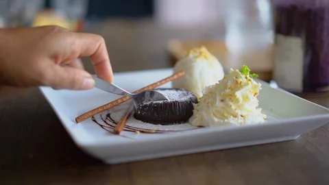 Close up, scoop the chocolate bread up to eat Stock Footage 111222421