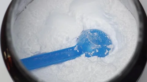 Close up of a scoop in a creatine powder Stock Footage 311755876