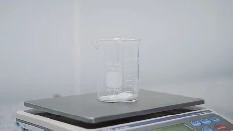 Close up scoop white powder into beaker Laboratory slow motion 50fps Stock-Footage 247484373
