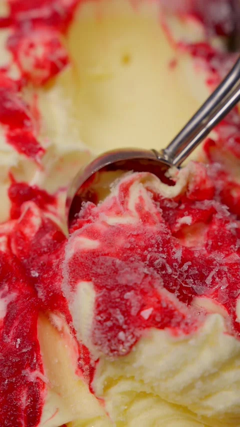 Close-up of scooping raspberry ice cream. Ice cream concept. Stock Footage 286735197
