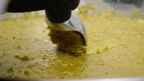 Close-up of Scooping Soft Yellow Cookie Pie Dough or Pistachio Filling Stock Footage 337751620