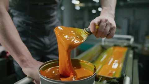 Close Up of Scooping Yellow Printing Ink on Spatula Knife in Factory Video stock 335482994