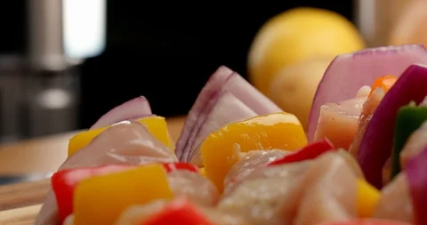 Close up of scrambling chicken and vegetables, making kebab Stock-Footage 126257800