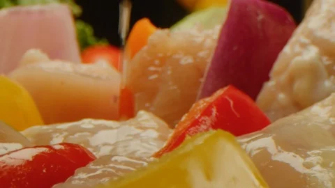 Close up of scrambling chicken and vegetables, making kebab Stockbeeldmateriaal 126259092