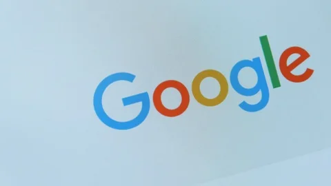 Close up screen with Google logo search engine slowly rotating Stock Footage 127447890
