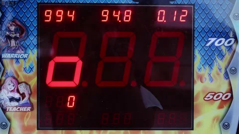 A close-up of the screen of the slot machine with red LED numerals shows the Stock Footage 197047440