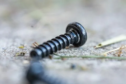 Close up of screw in car workshop when repairing lawnmower Foto stock