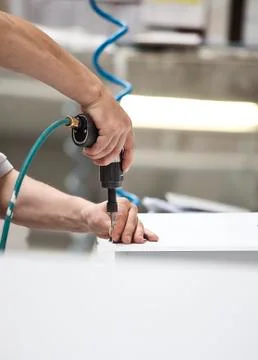 Close up screw machine and hand Stock Photos