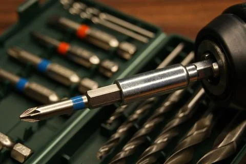 A close-up of a screwdriver bit, and a bit set. Stock Photos