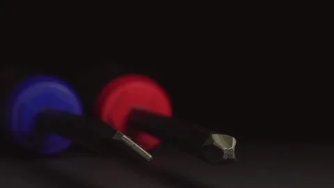 Close-up of screwdriver tips on a turntable  view of specialized screw tip Stock Footage 258379585