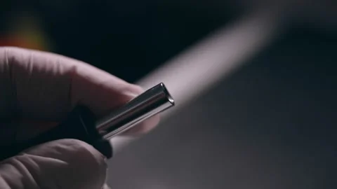 Close-up. Screwdriver unscrews the screw from the computer hard drive. Male 動画素材 144452128