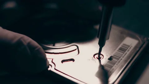 Close-up. Screwdriver unscrews the screw from the computer hard drive. Male 動画素材 233455087