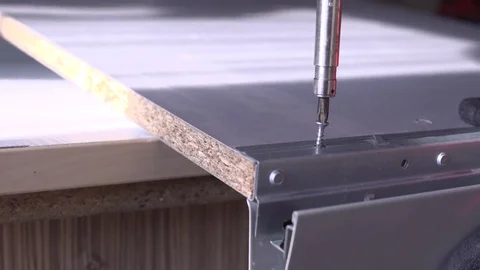 Close-up of screwdriving a drift bolt with a drill. Stock Footage 82584461