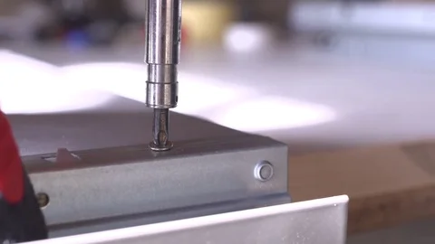 Close-up of screwdriving a drift bolt with a drill. Stock Footage 82584702