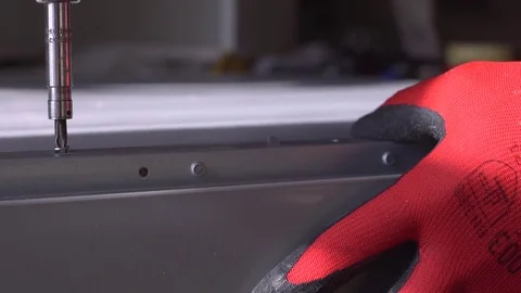 Close-up of screwdriving a drift bolt with a drill. Stock Footage 82585158